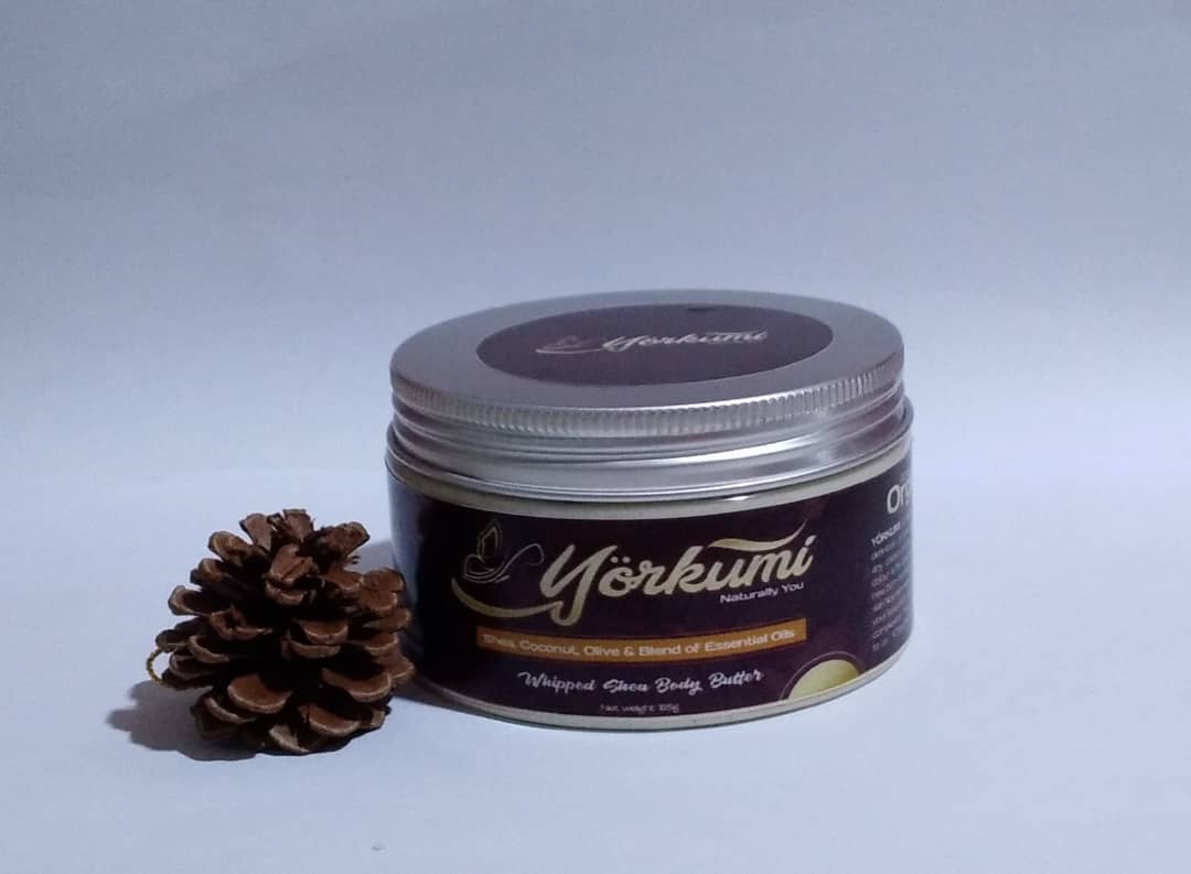 A jar of pure unrefined shea butter body butter for moisturizing a baby's skin and a sensitive skin.